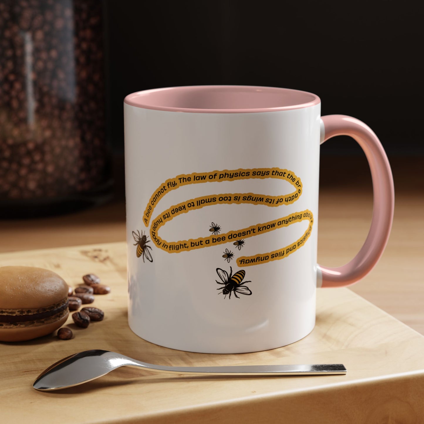 Pink accent inspirational bee coffee mug styled on a modern kitchen counter