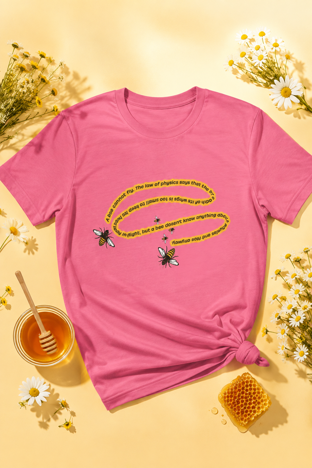 Charity Pink bee quote T-shirt flat lay with honey, daisies and chamomile