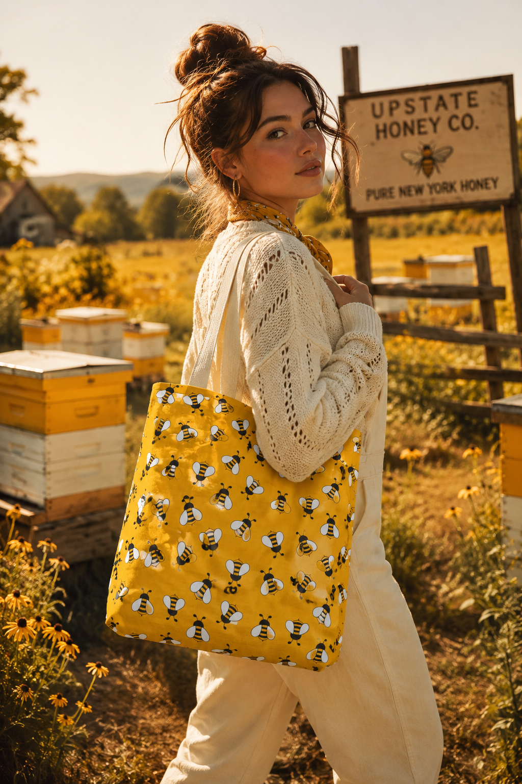 Woman carrying a yellow bee tote bag at a honey farm
