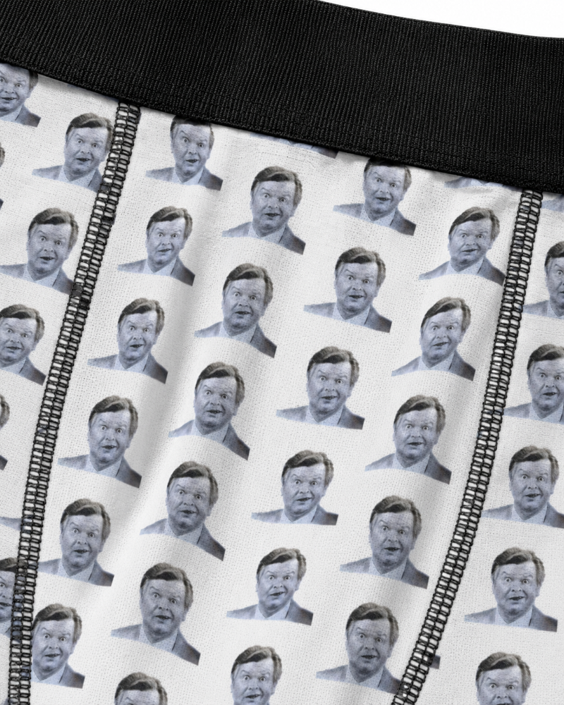 Close-up of Benny Hill boxer briefs fabric with repeating portrait print, black stitching and black waistband
