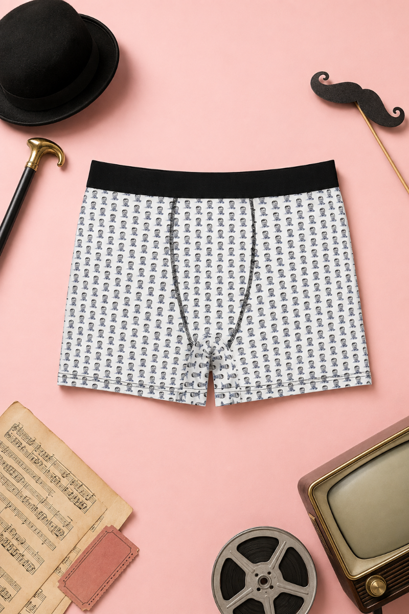 Benny Hill men’s boxer briefs flat lay with white portrait pattern, black waistband and retro comedy styling