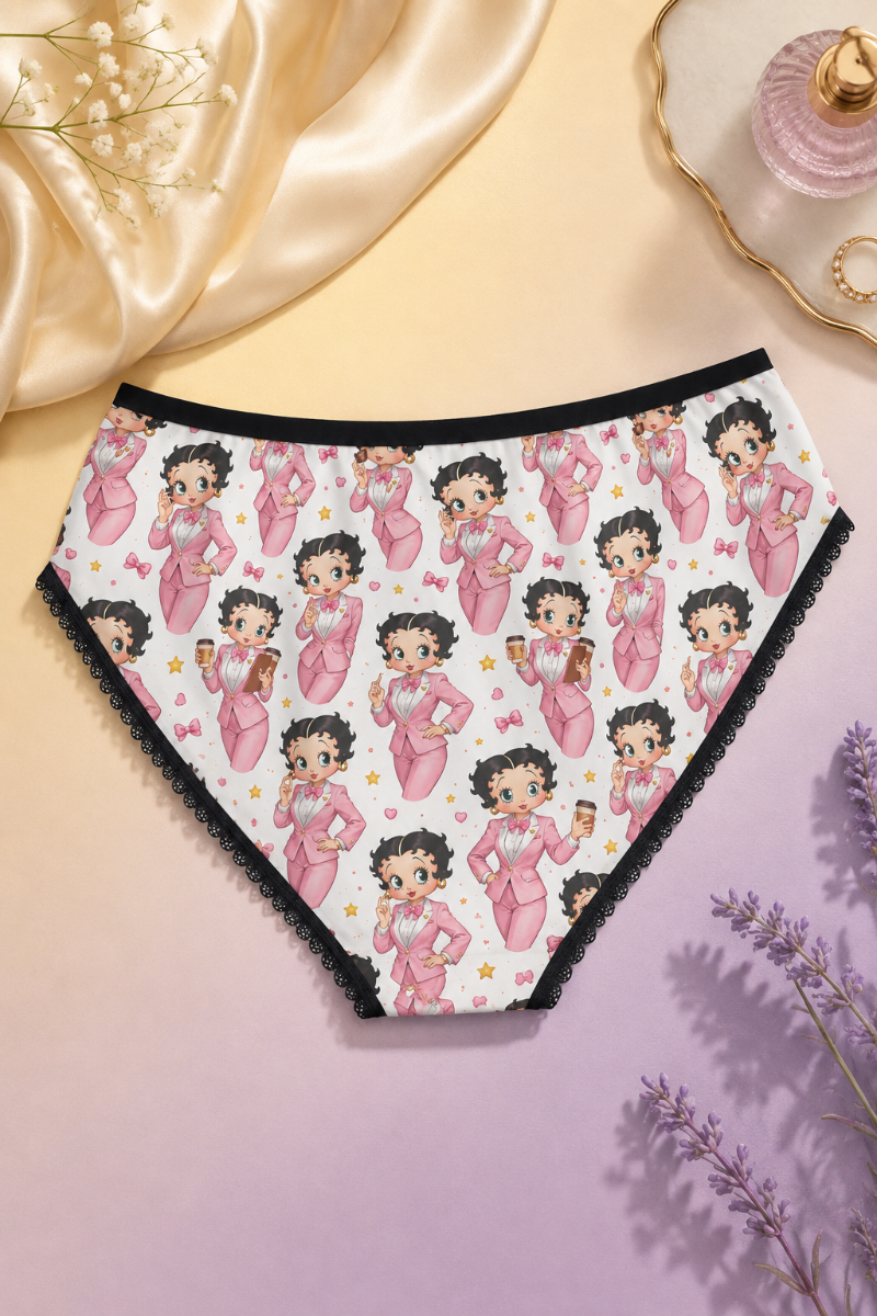 Back view of Betty Boop pink print women’s briefs styled on a soft yellow and lavender pastel background
