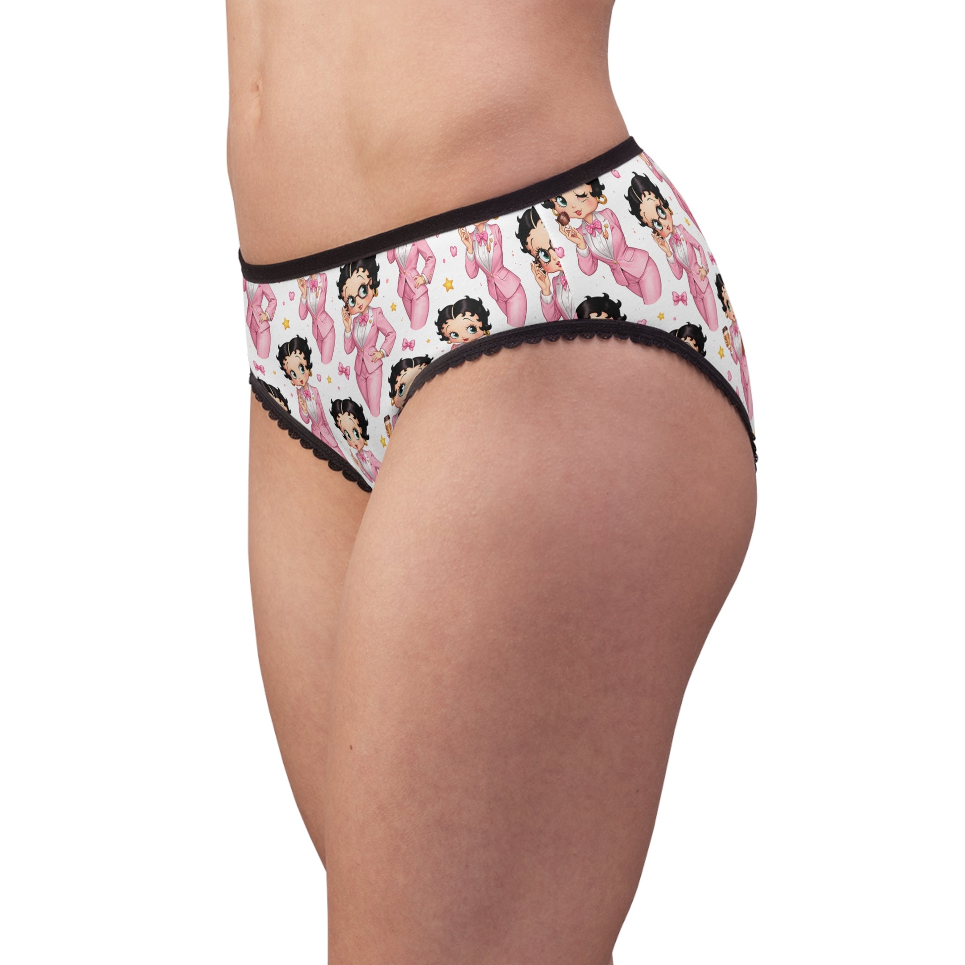 Side view of model wearing Betty Boop women’s briefs with pink character print and black lace trim