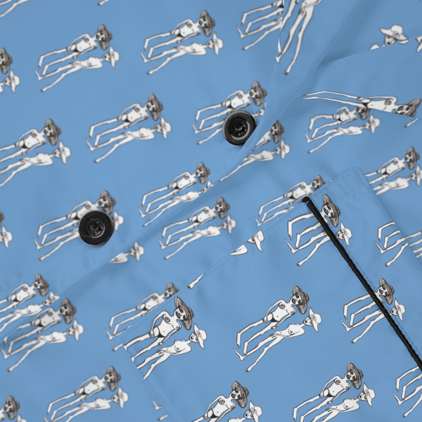 Close-up of Bikini Nenas satin pajama fabric showcasing original hand-drawn artwork and smooth silky texture.