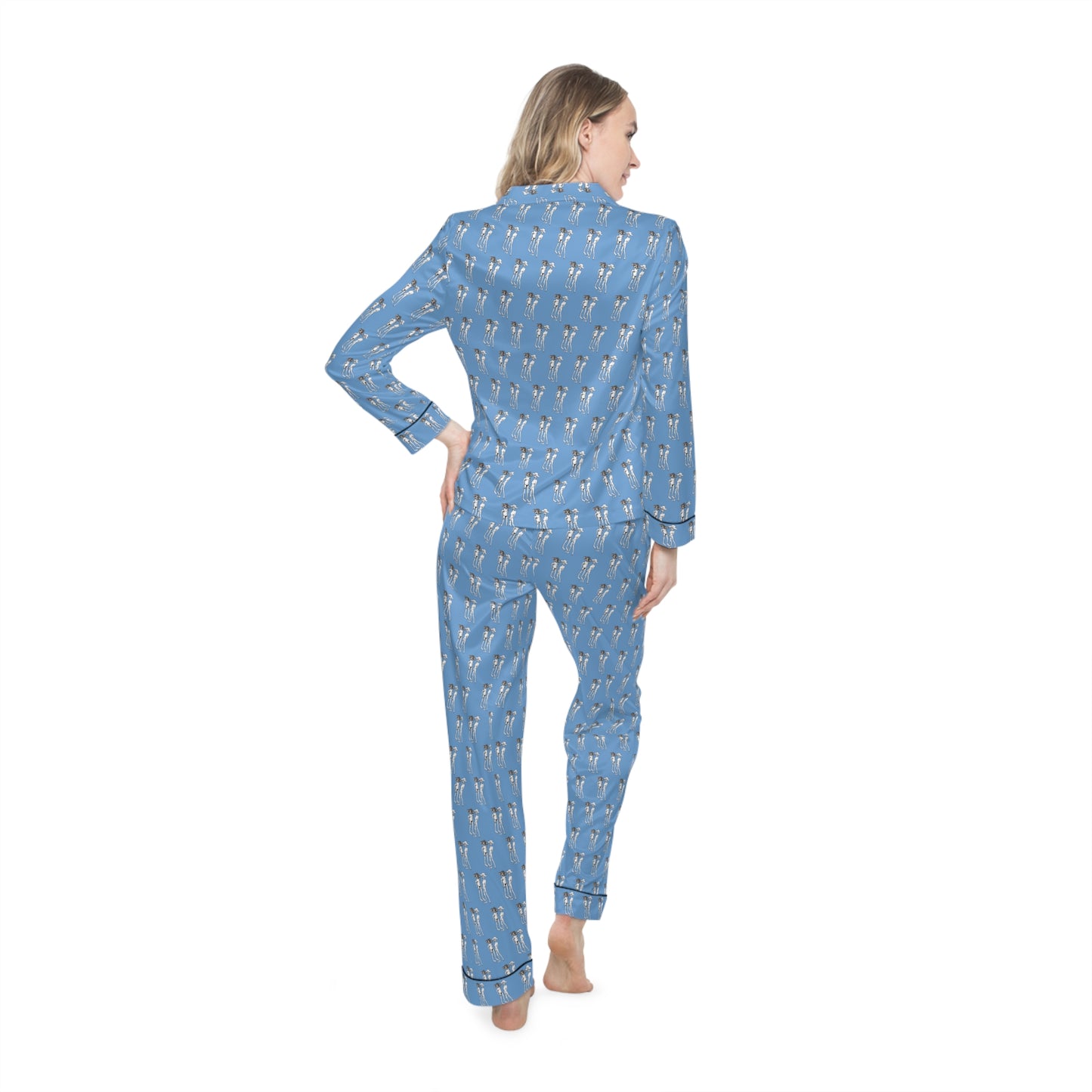 Back view of female model wearing Bikini Nenas women's satin pajama set featuring all-over blue artistic print.