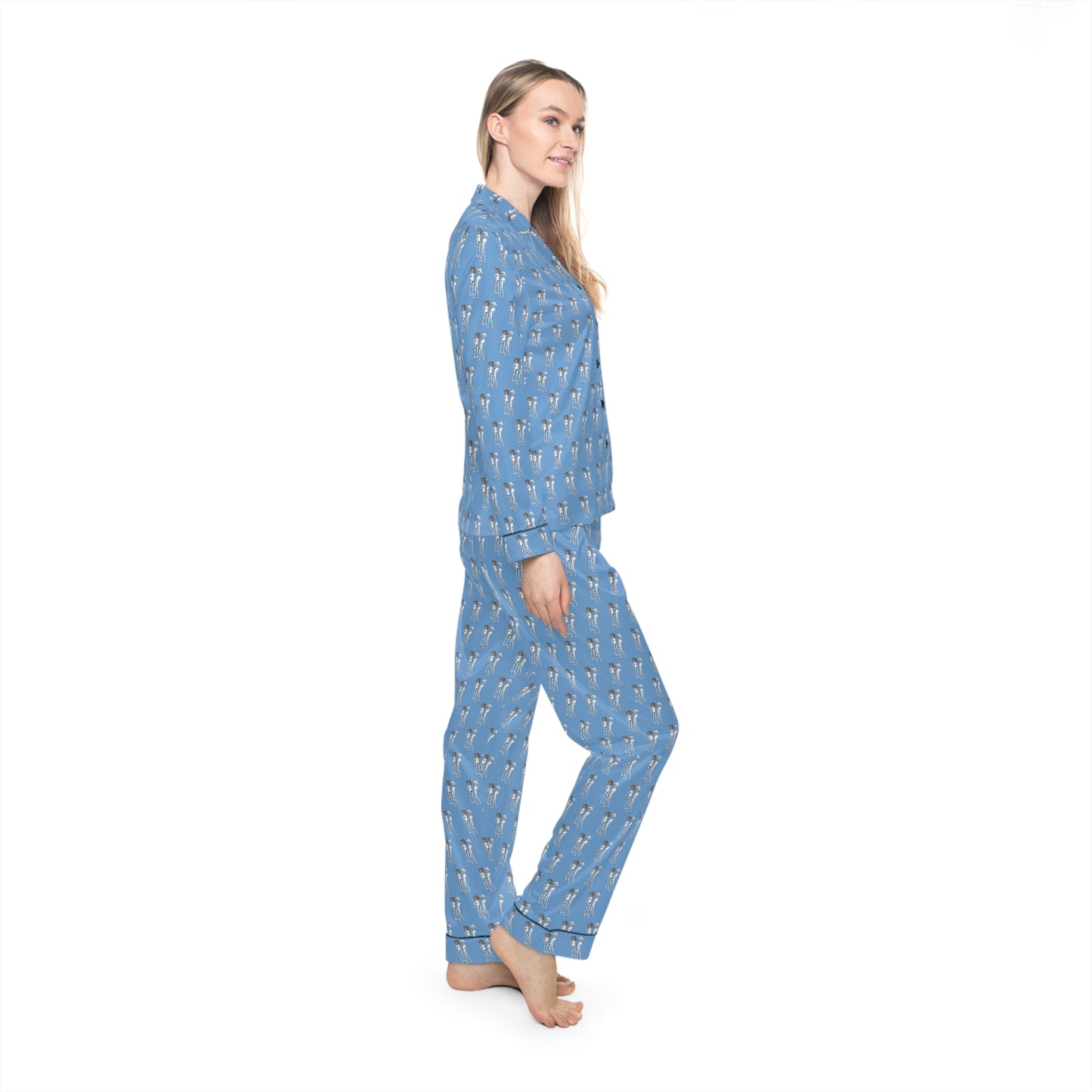 Side view of female model wearing Bikini Nenas women's satin pajama set with silky fabric and original hand-drawn artwork.