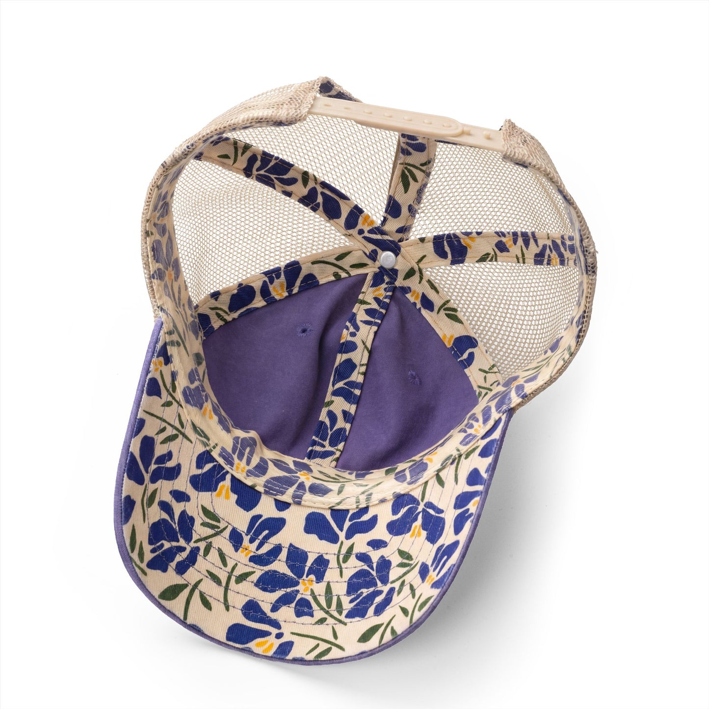 Underside of blue floral mesh trucker hat.