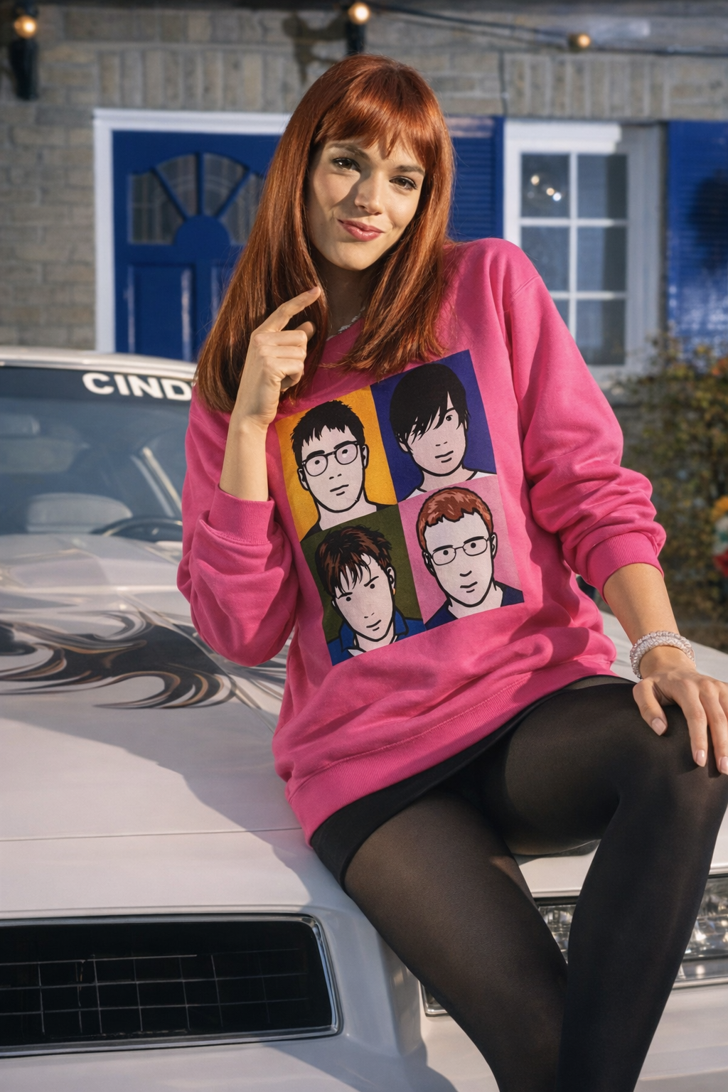 Woman wearing the pink Blur Best Of Album Sweatshirt in a casual retro lifestyle setting