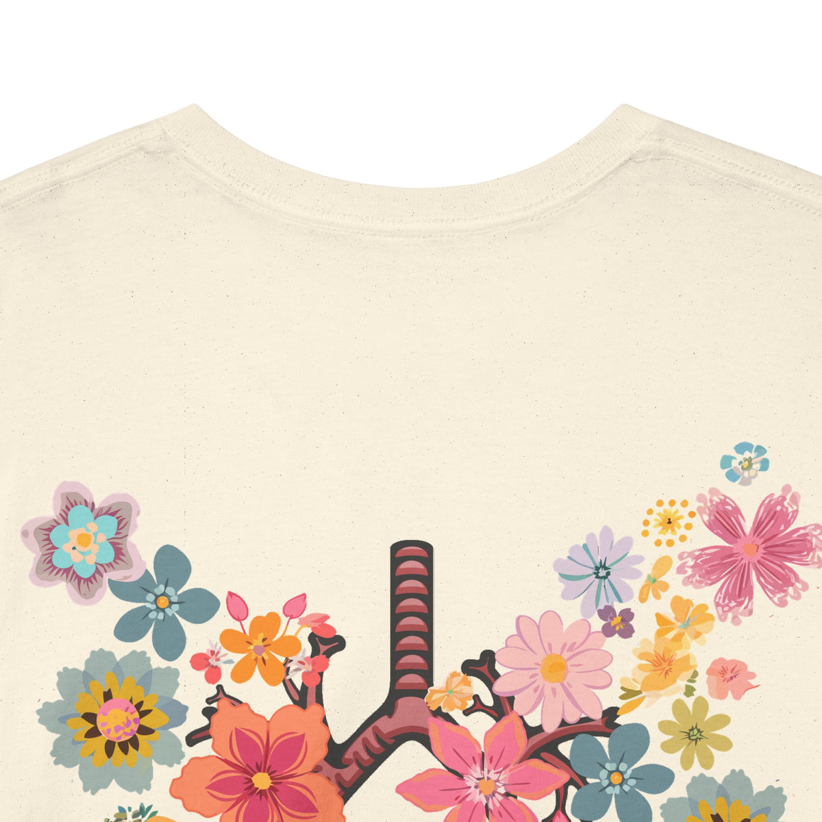 Close-up of the colorful flowers and branching airways printed on the back of the ivory Breath T-shirt.