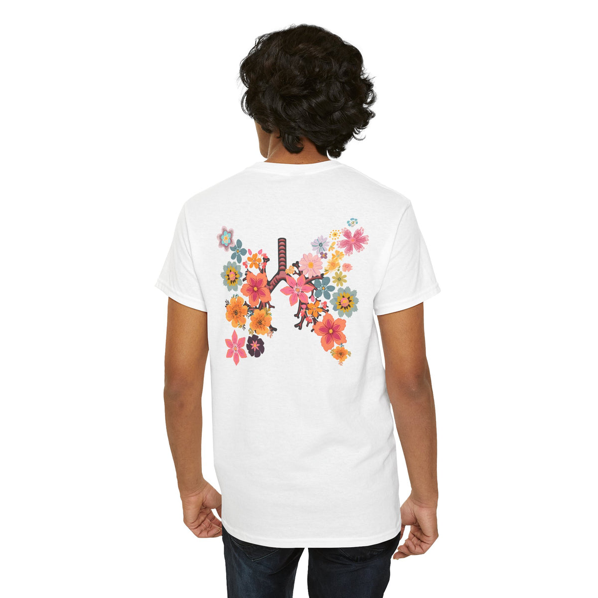 Model wearing the white Breath T-shirt with the colorful floral lungs graphic centered on the back.