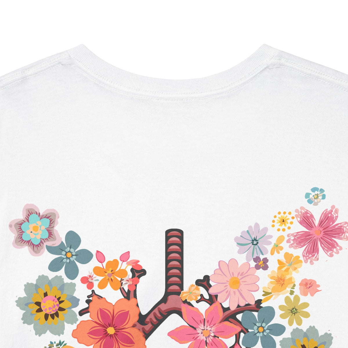 Close-up of the pink, orange, yellow, and blue floral lungs artwork on the white Breath T-shirt.