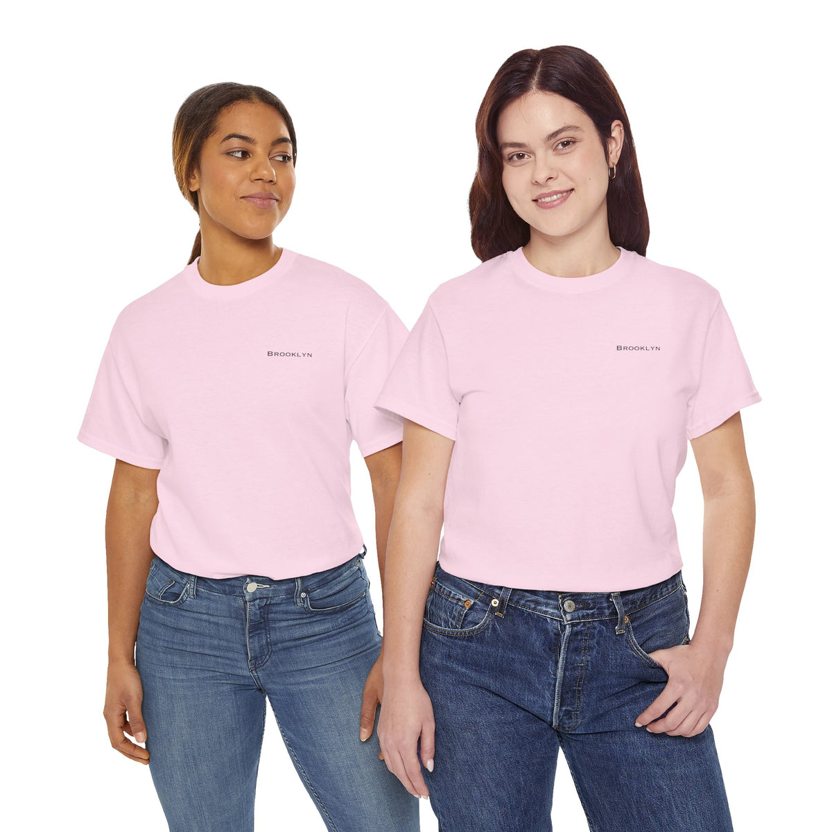 Two women wearing pink Brooklyn crewneck T-shirts with blue jeans.