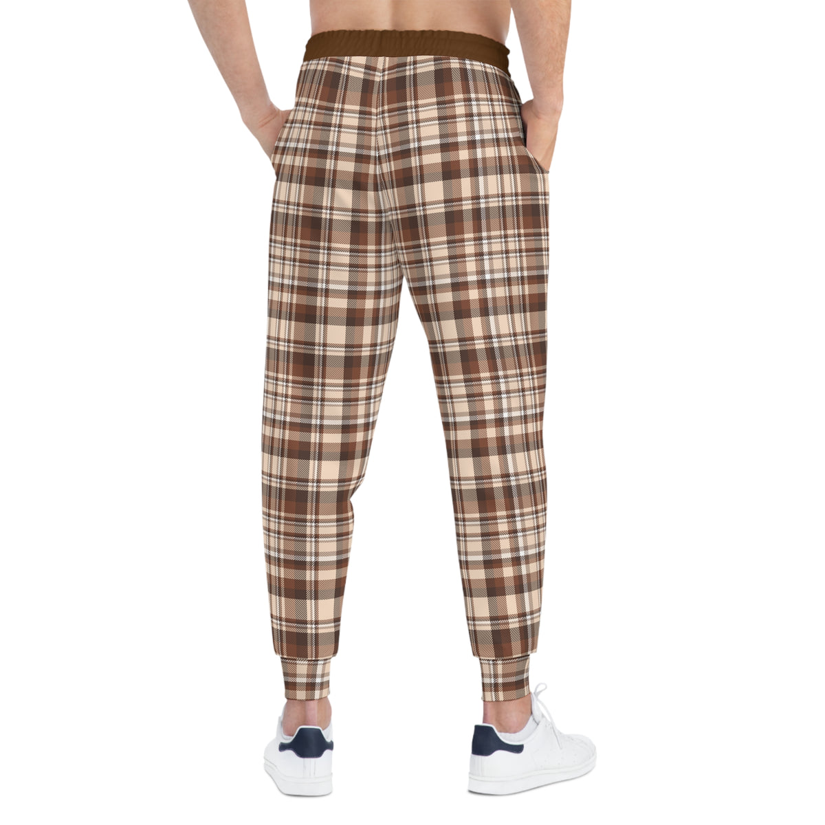 Back view of brown plaid joggers on model showing tapered leg and fitted ankle cuffs