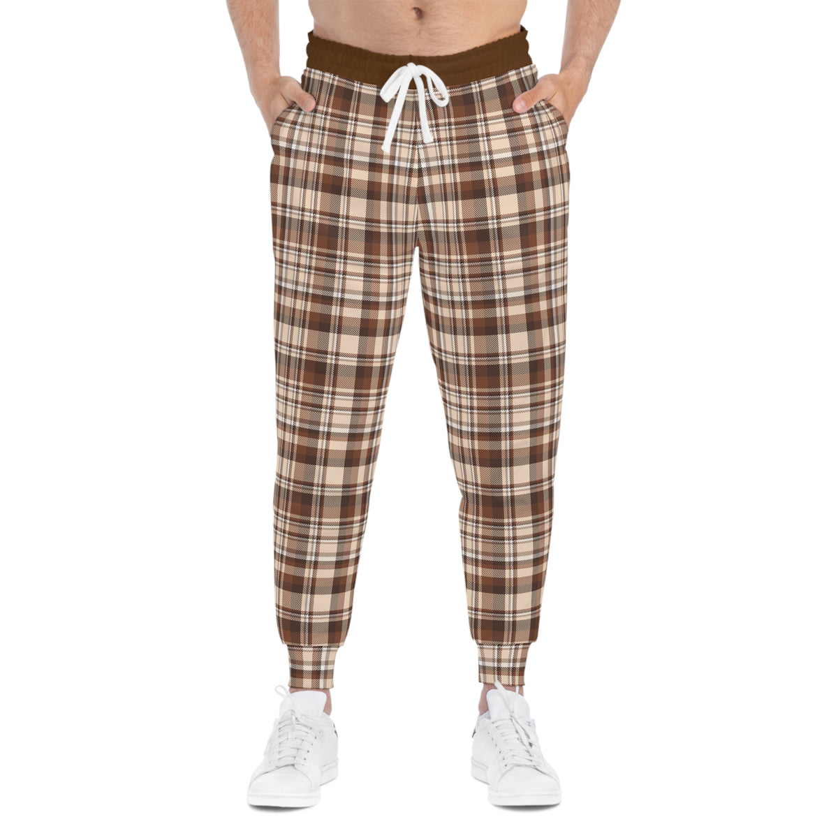 Front standing model wearing brown plaid joggers with hands in pockets, casual everyday look
