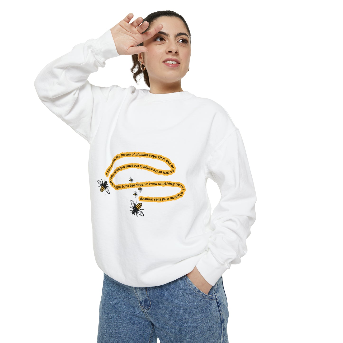 Woman modeling a white bumblebee graphic crewneck sweatshirt with blue jeans.