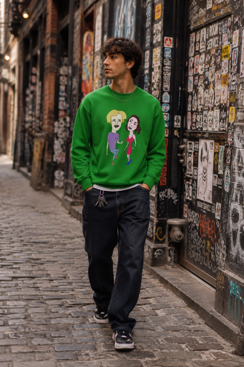 Gen Z man wearing a green cartoon couple graphic sweatshirt while walking through a sticker-covered cobblestone alley in SoHo, New York City