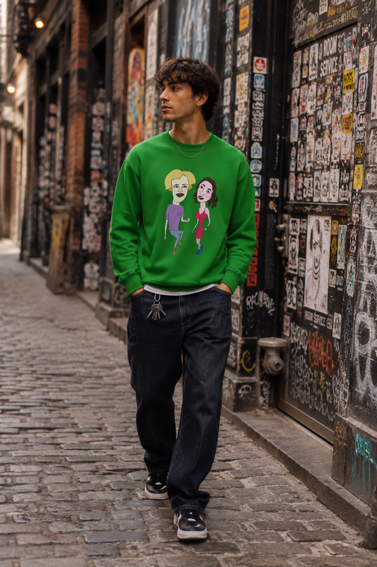 Gen Z man wearing a green cartoon couple graphic sweatshirt while walking through a sticker-covered cobblestone alley in SoHo, New York City