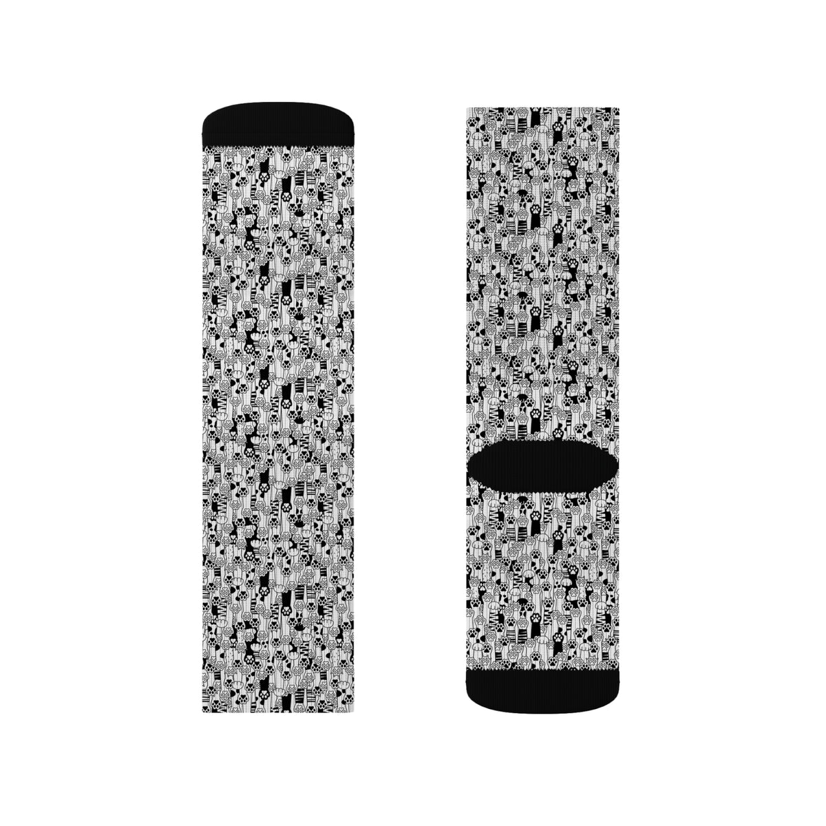 Product view of black and white cat paw print crew socks with black heel and toe details.
