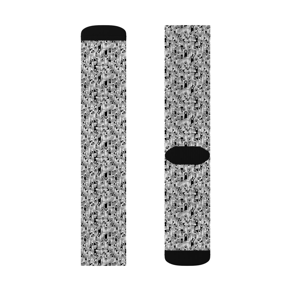 Multiple views of black and white cat paw print crew socks showing the all-over animal pattern.