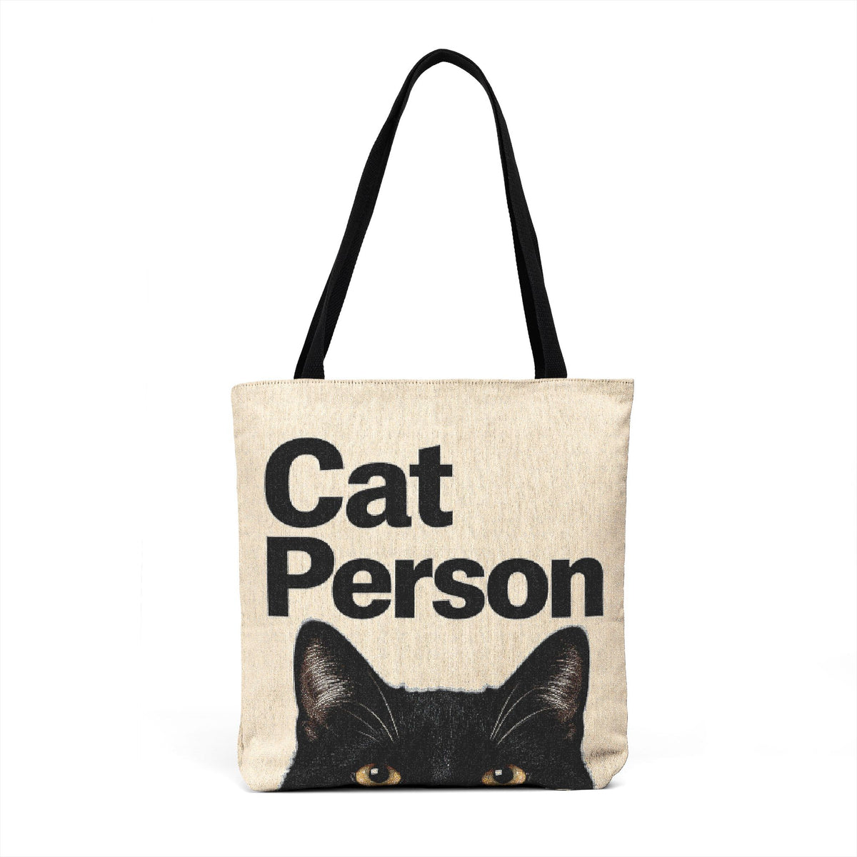 Cat Person black cat graphic tote bag with black straps on a neutral background