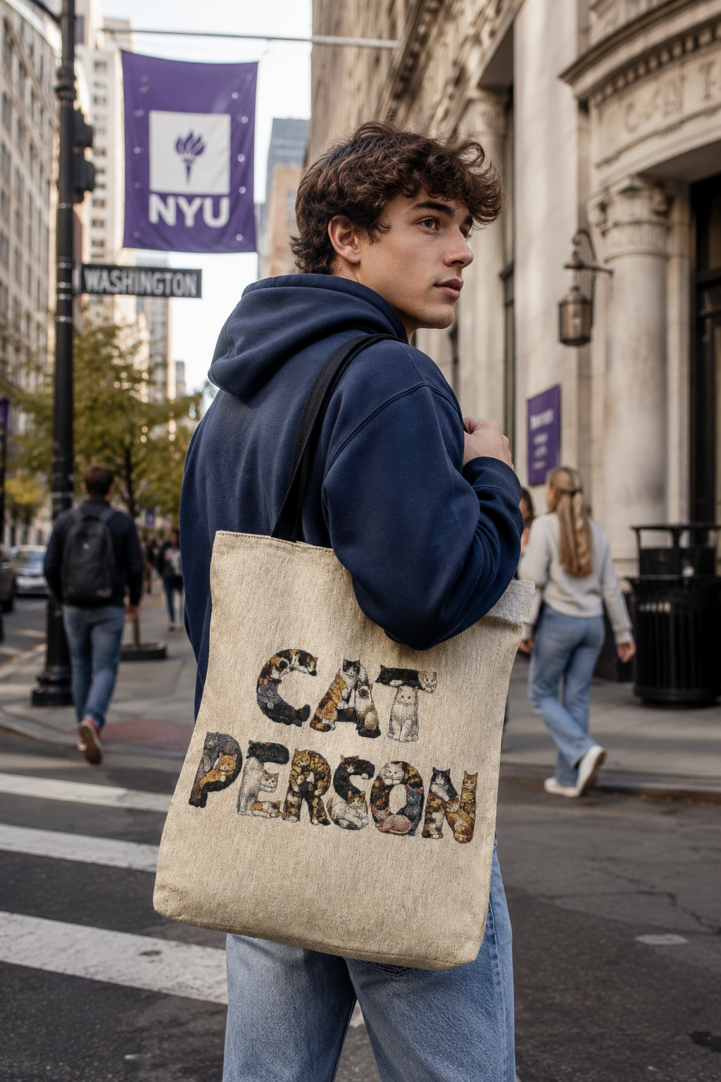 Male Gen Z student carrying the Cat Person woven tote bag while walking to class on a New York City college campus