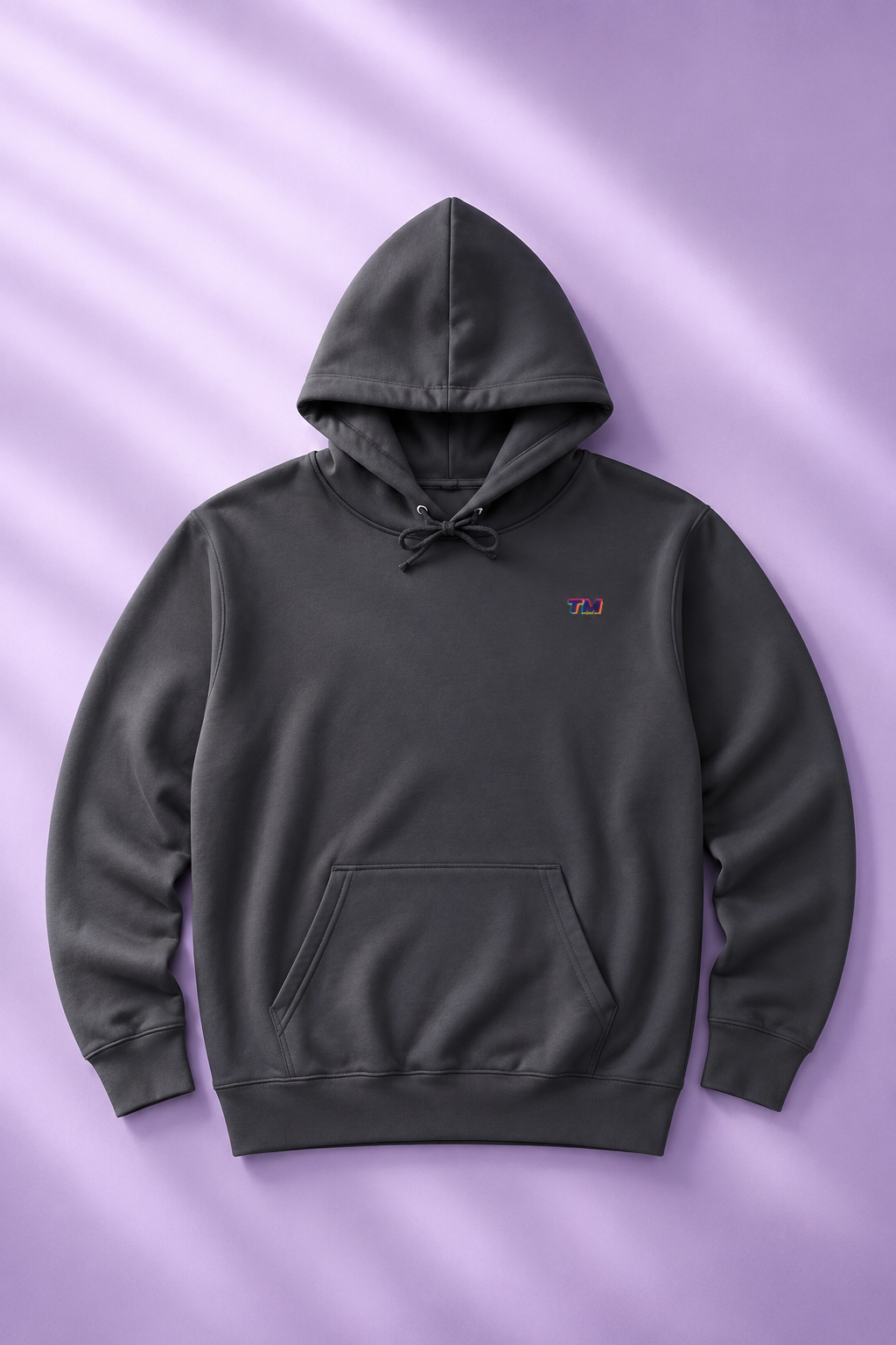 Tantrum Media EcoSmart charcoal EcoSmart hoodie flat lay on a soft lavender pastel background.
