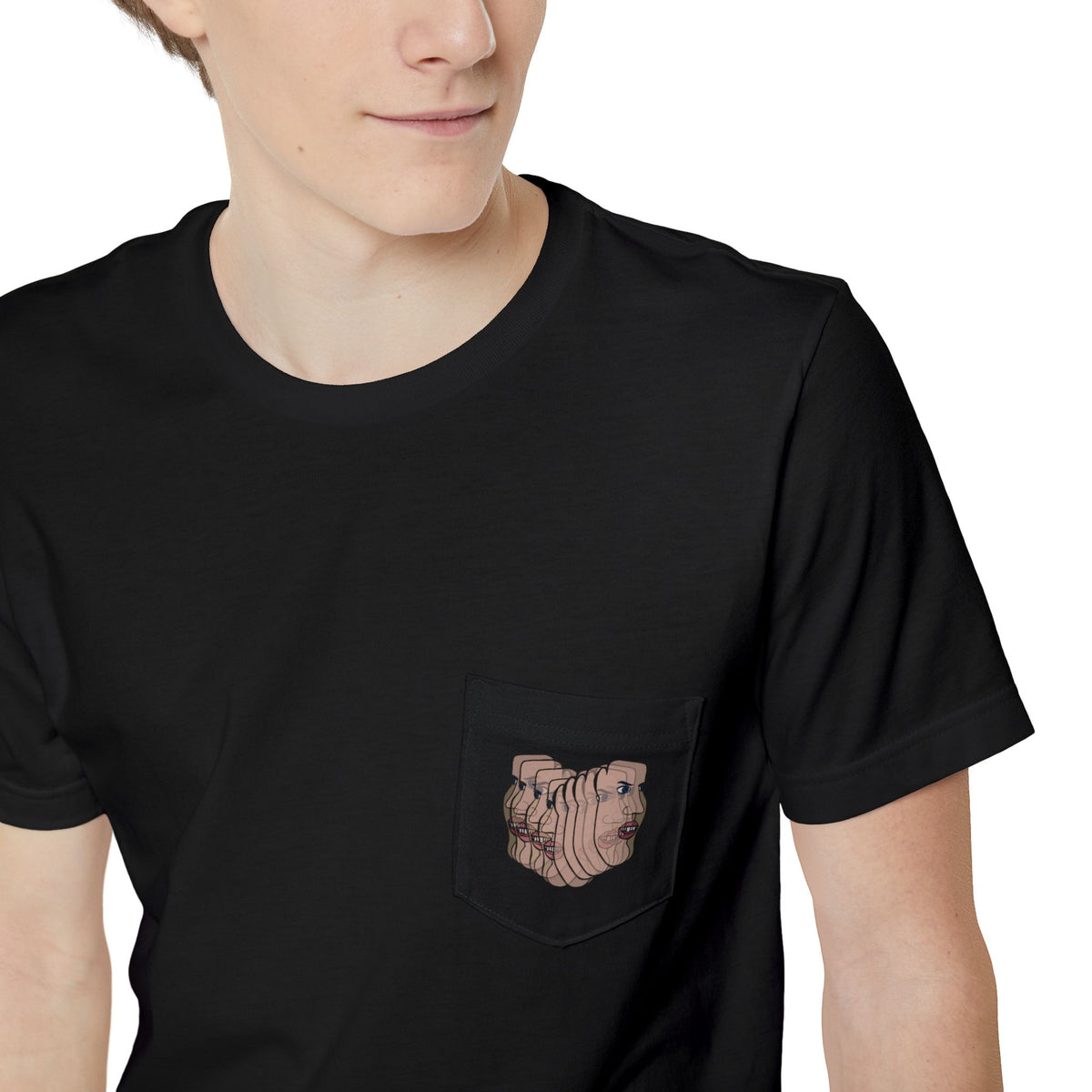 Close-up of the Charlie Deluxe abstract face graphic pocket on a black T-shirt