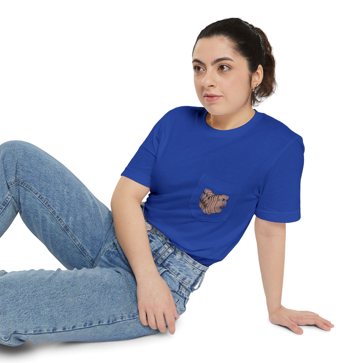 Woman wearing the Charlie Deluxe abstract face pocket T-shirt in blue with jeans