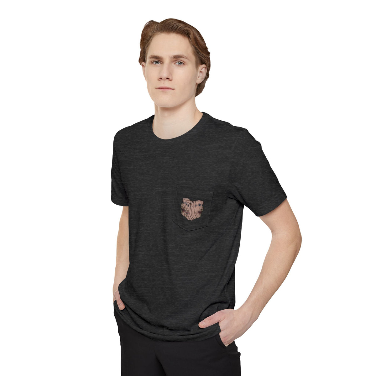 Man wearing the Charlie Deluxe abstract face pocket T-shirt in charcoal gray