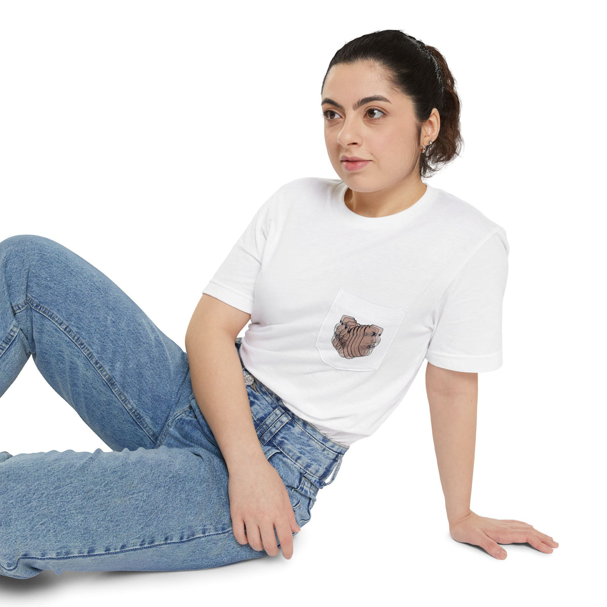 Woman wearing the Charlie Deluxe abstract face pocket T-shirt in white with jeans