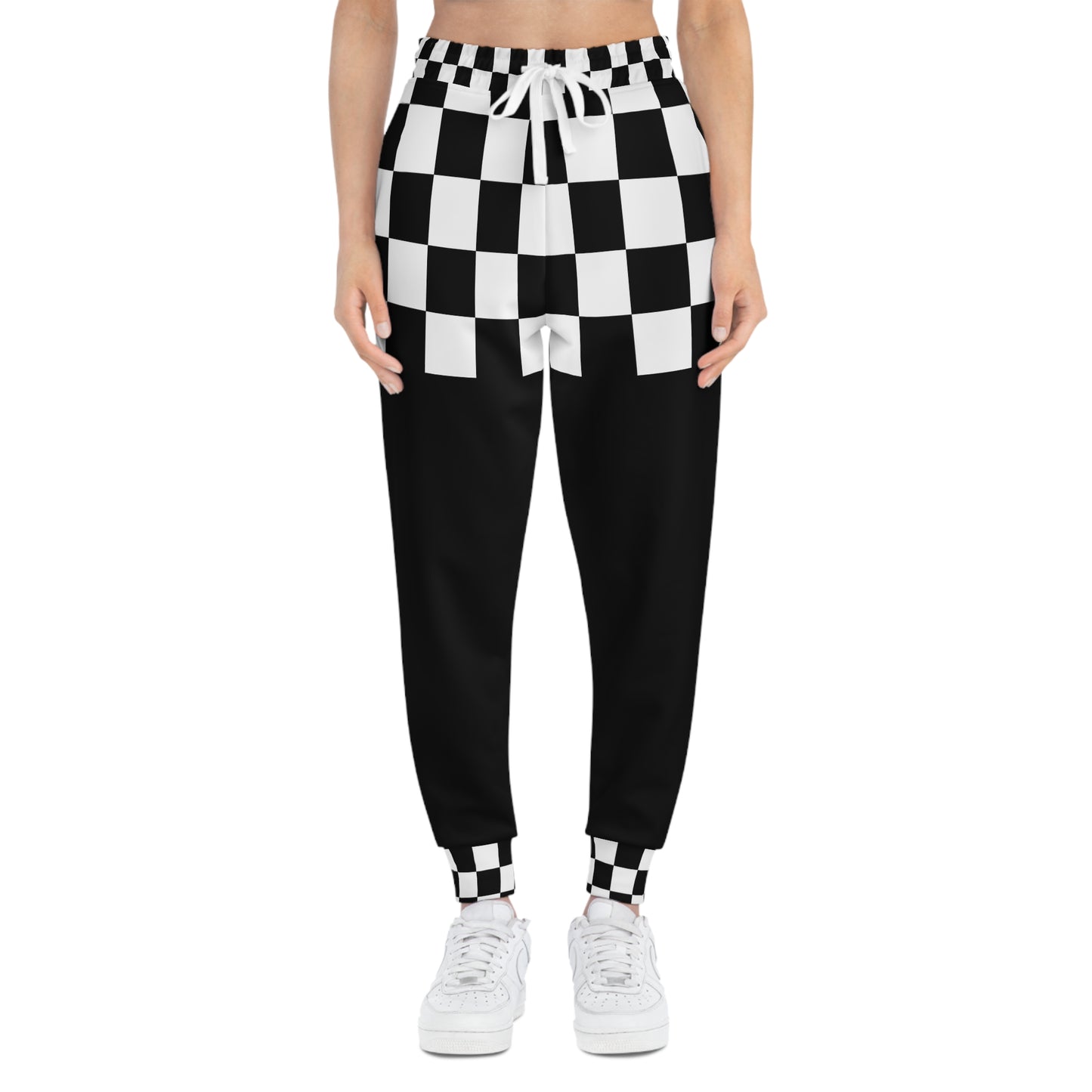 Front model view of Chess Clash Checkerboard Joggers highlighting the black and white chess-inspired pattern.