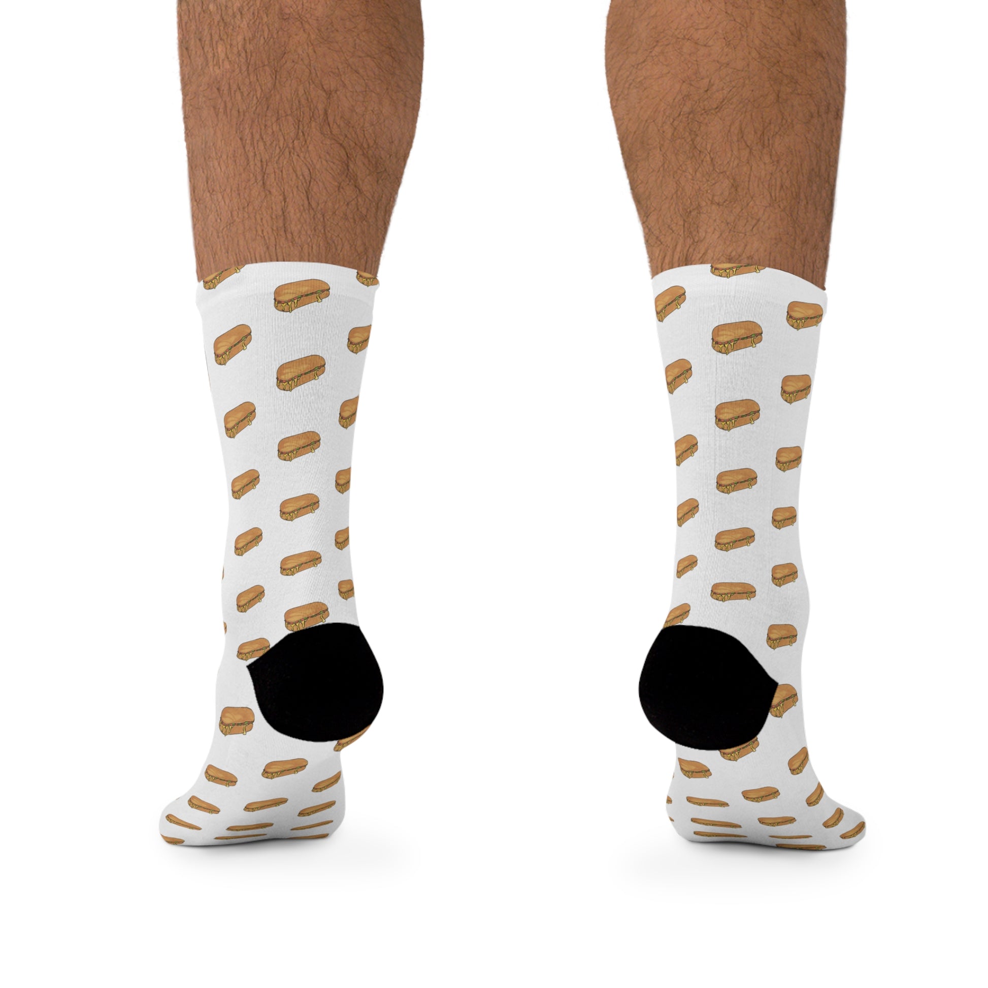 Chopped cheese unisex crew socks on male model back angled view showing NYC deli sandwich pattern and heel detail on white background