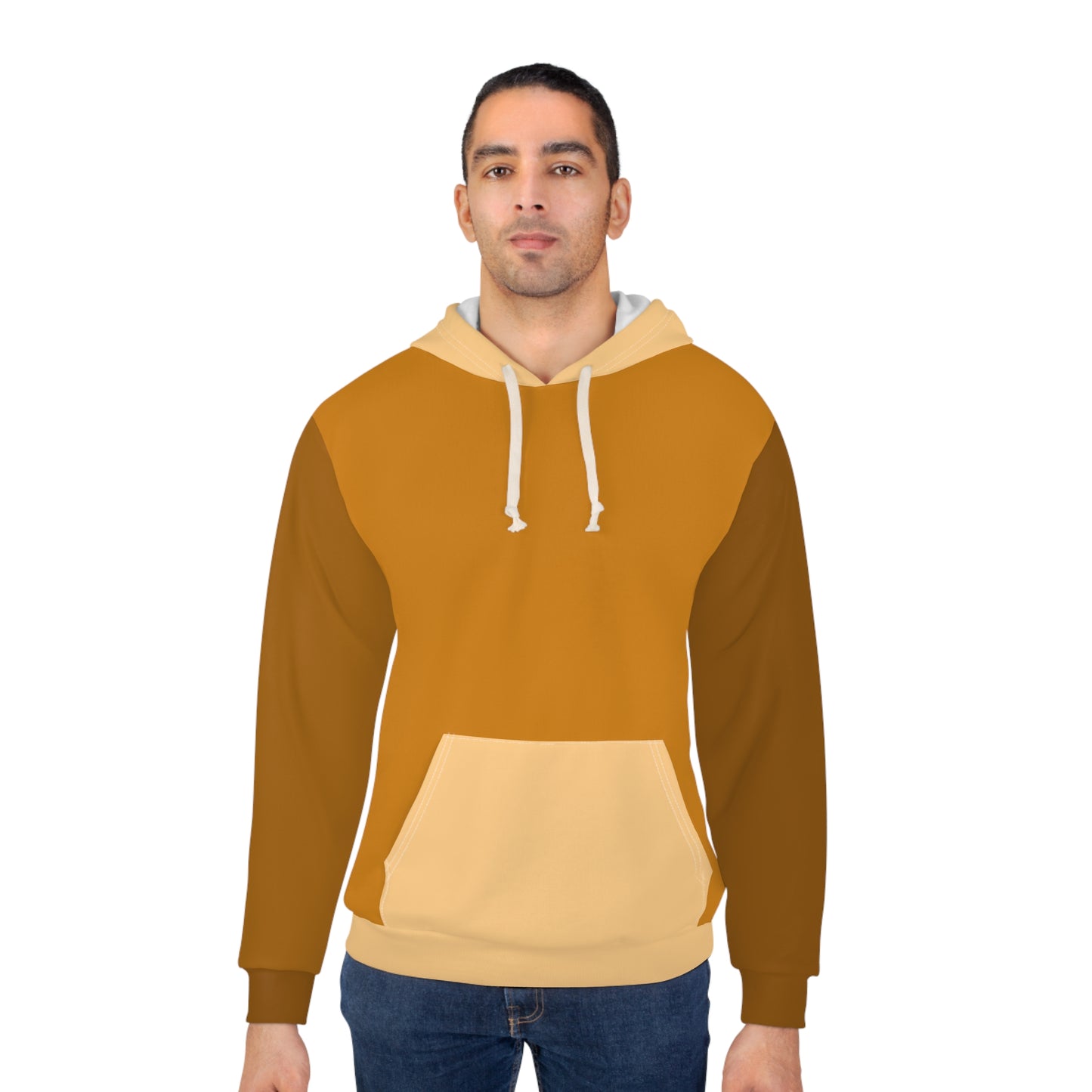 Male model wearing the Cinnamon Brown unisex hoodie featuring warm mustard, brown, and beige color-block panels with a front pocket and drawstring hood against a clean white background.