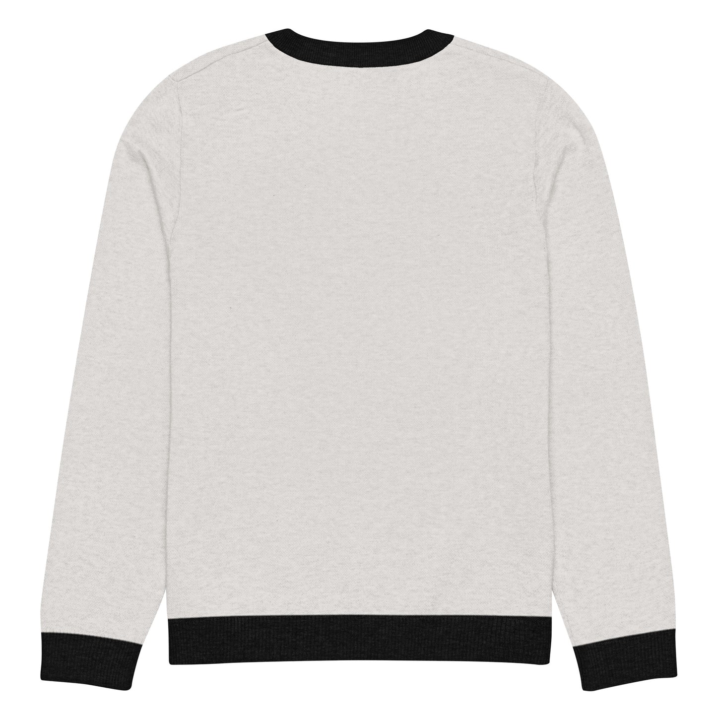 Flat back view of the light sweater showing solid color and black cuffs and hem.
