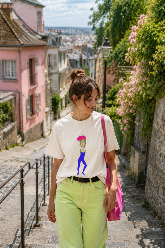 Cody graphic unisex t-shirt in cream worn by woman in Paris street lifestyle scene