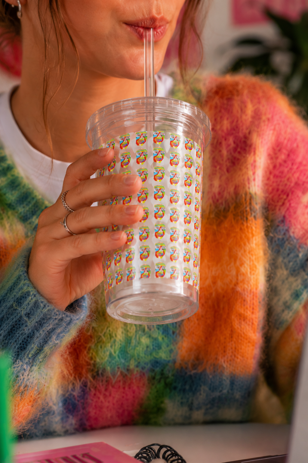 Woman holding the Colorfest artist-designed insulated acrylic tumbler featuring original NYC artwork