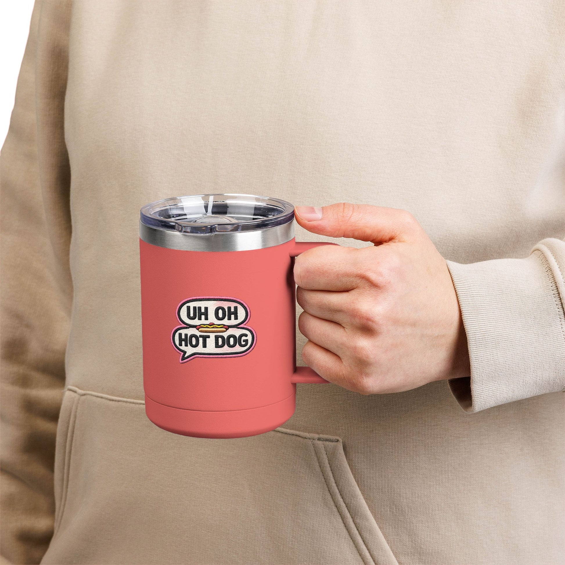 Person holding a coral Uh Oh Hot Dog MADtv insulated stainless steel travel mug