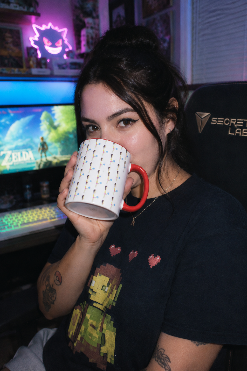 Young gamer drinking from the Cotton Candy Illustrated Mug at a colorful gaming desk setup.