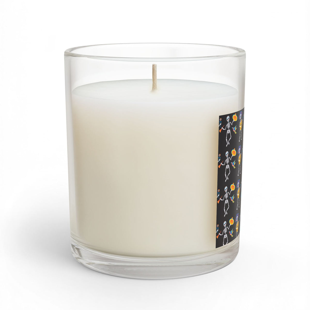 Back view of Dancing Skeletons candle in a clear glass jar on a white background