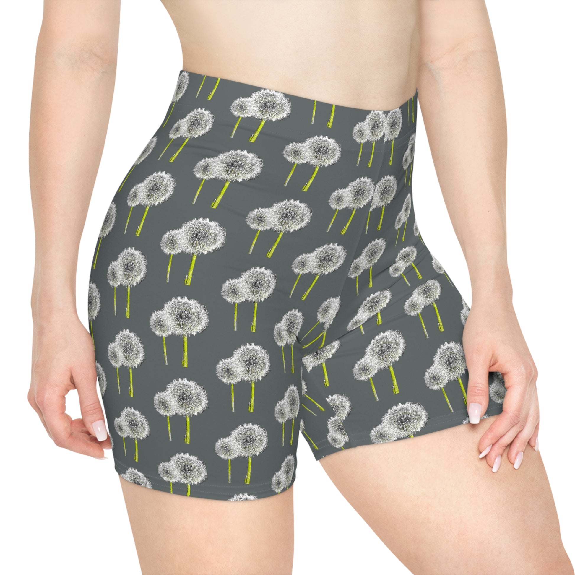 Model wearing dandelion print bike shorts with nature-inspired floral artwork