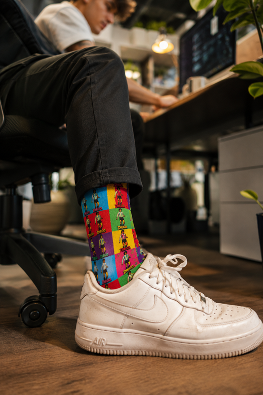 Gen Z male wearing Diego Maradona pop art unisex crew socks in a modern office setting