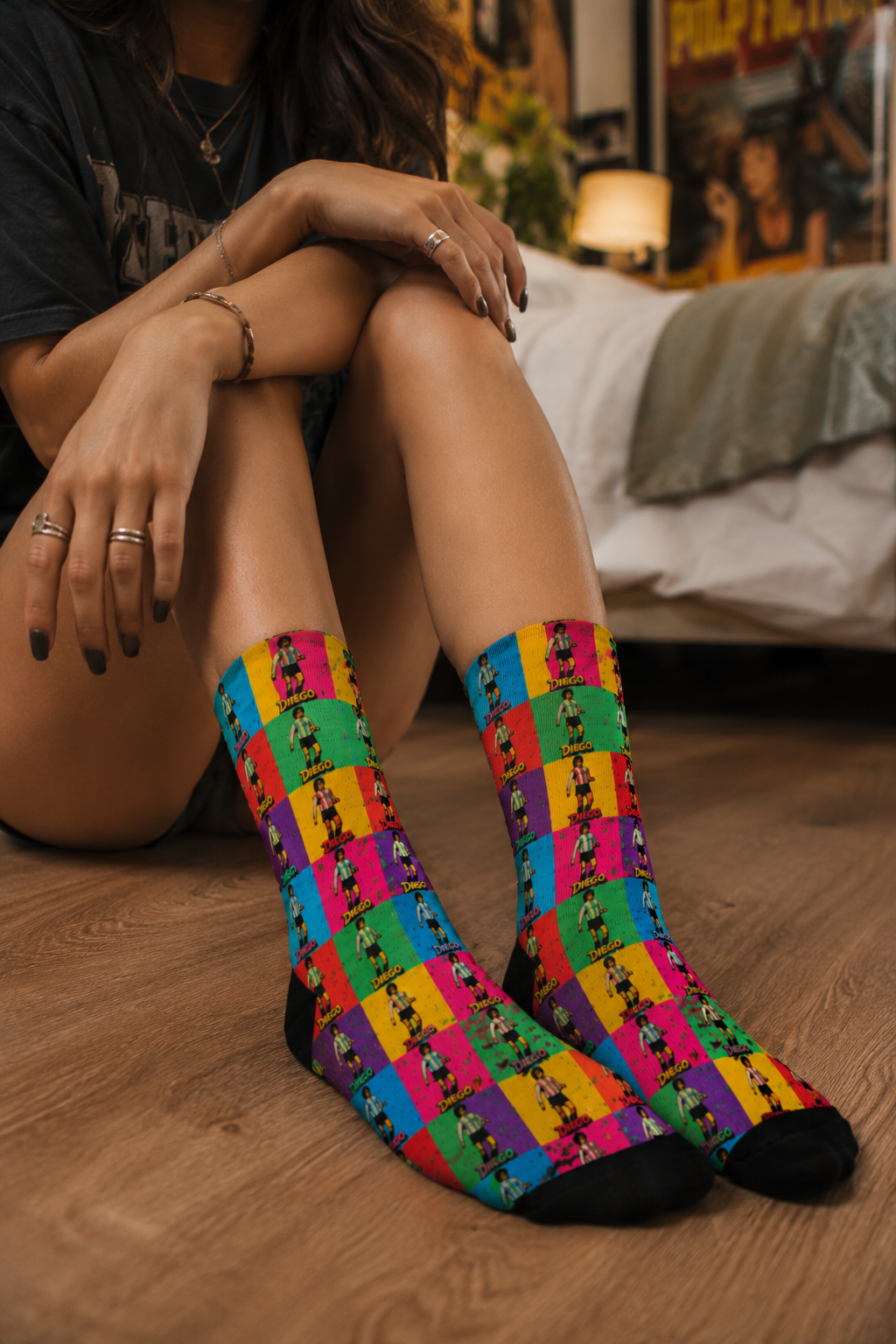 Close-up of Diego Maradona colorful crew socks in cozy bedroom scene
