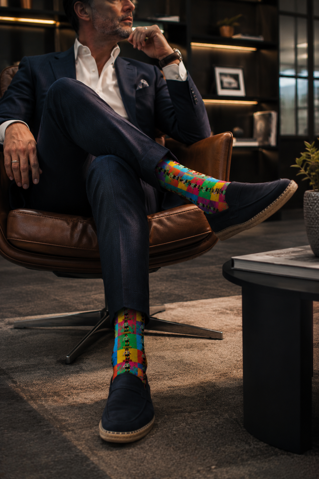 Diego Maradona colorful crew socks styled in luxury editorial office lounge