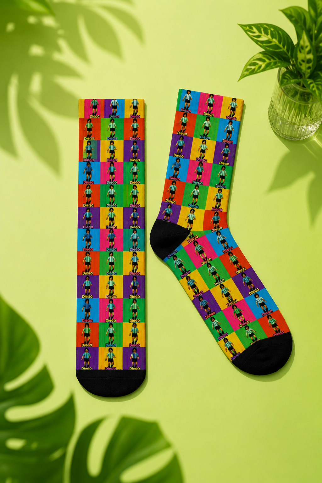 Diego Maradona pop art crew socks flat lay on pastel lime green background