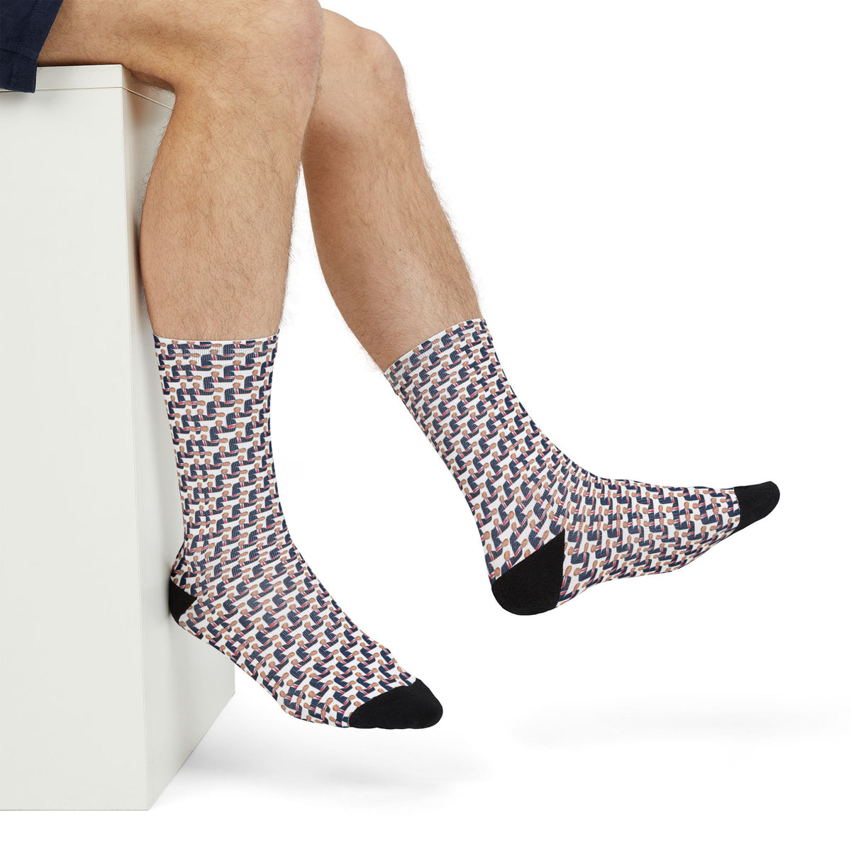 Seated man wearing Donald Trump Crew Socks in a casual lifestyle setting