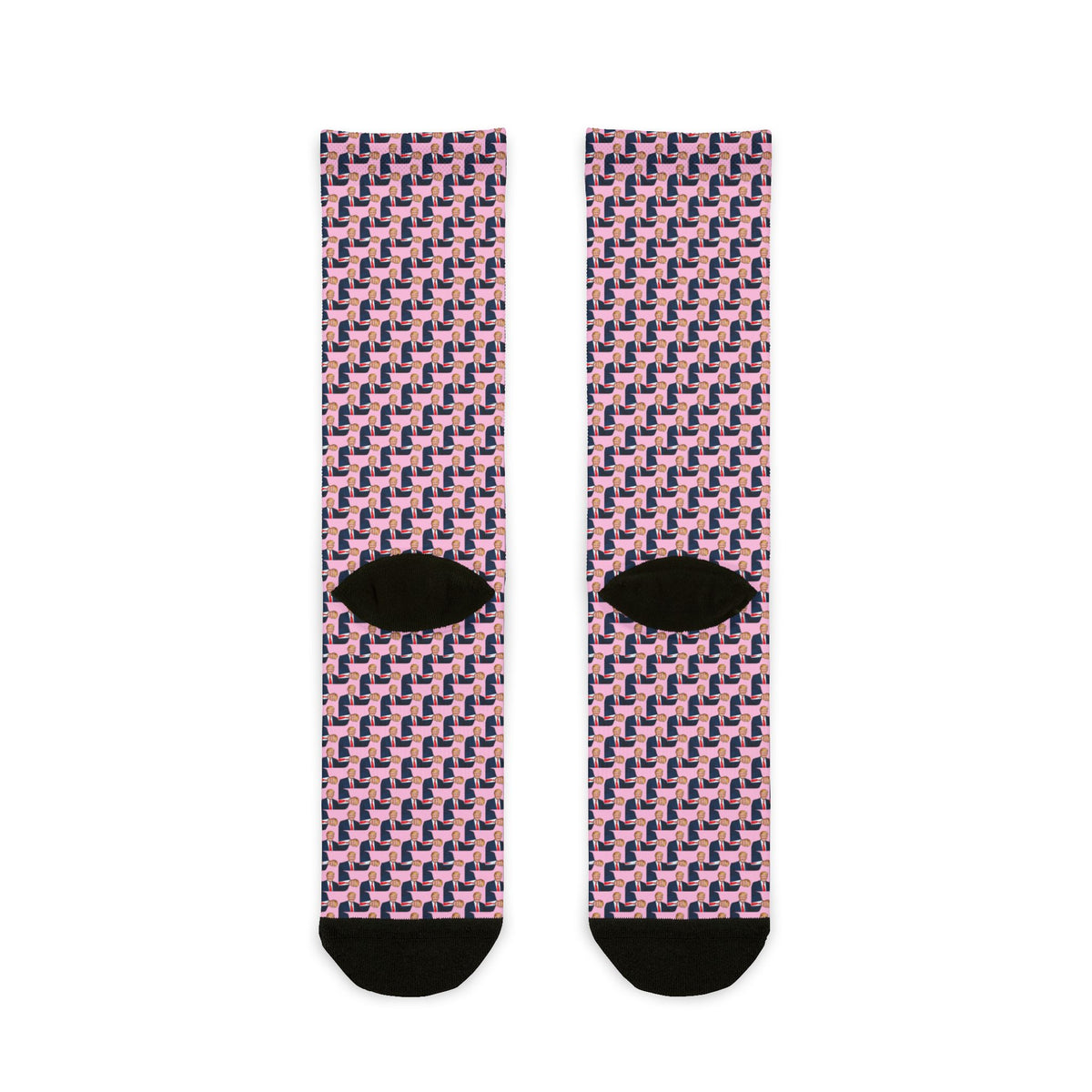 Pair view of Donald Trump pink crew socks laid flat with repeating portrait print and black heel and toe