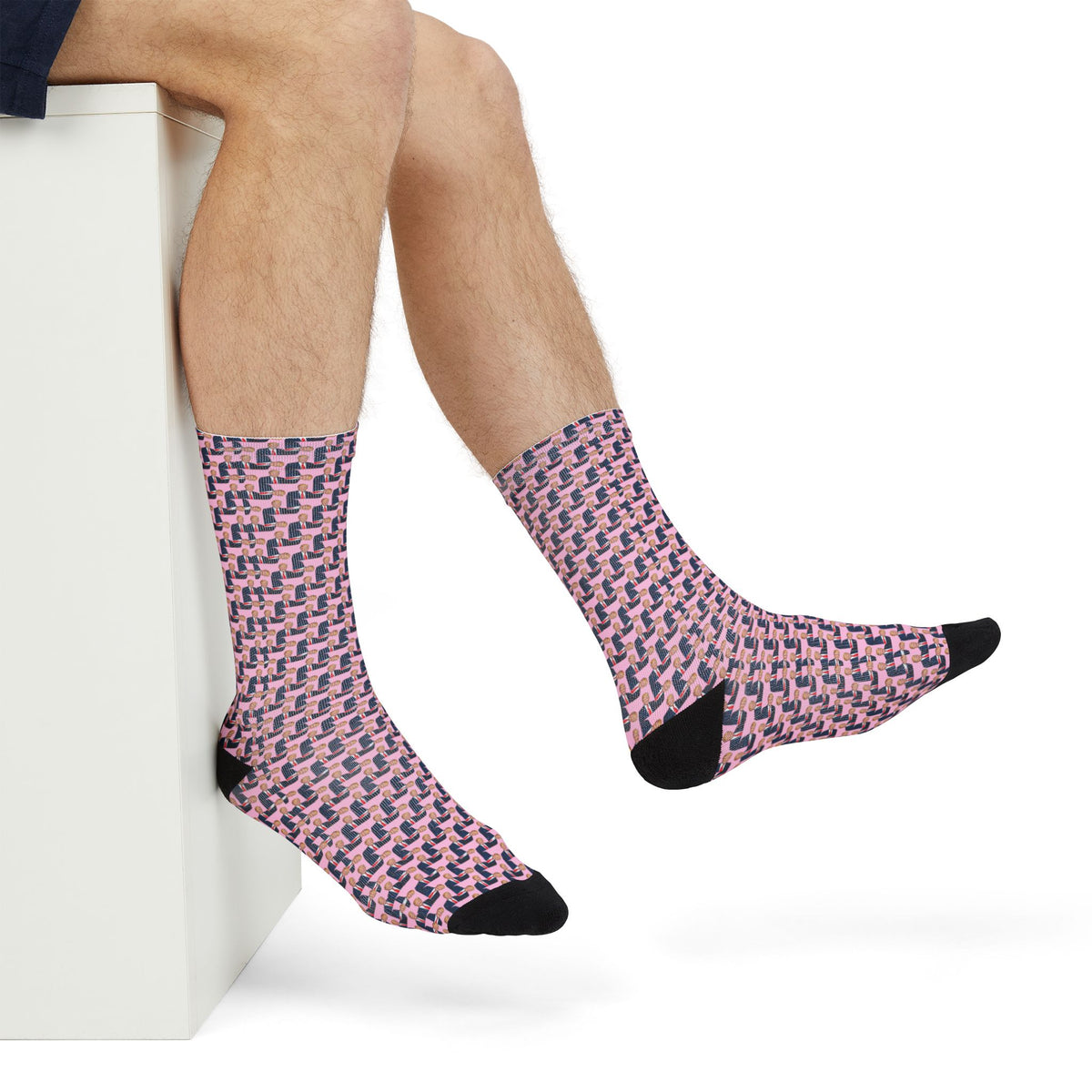Donald Trump pink crew socks shown in a seated casual lifestyle view with black toe detail