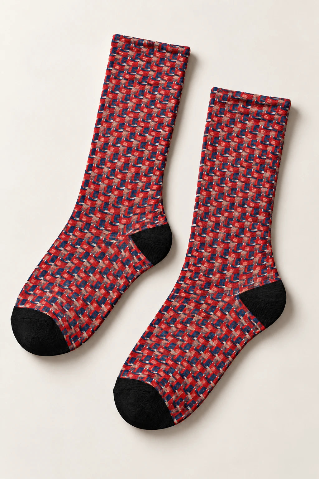 Flat lay of Donald Trump red crew socks with repeating portrait pattern and black heel and toe