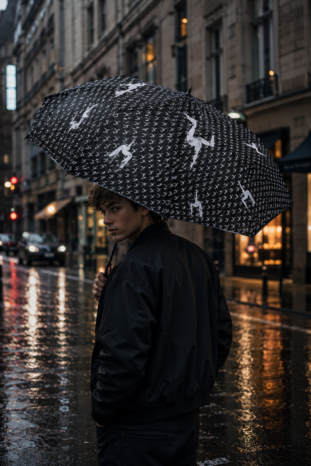 Young person carrying Elastika umbrella while standing on a cinematic rainy city street