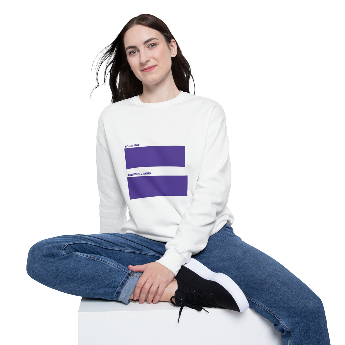 Woman wearing the Equal Pay For Equal Work statement sweatshirt in a casual lifestyle setting.